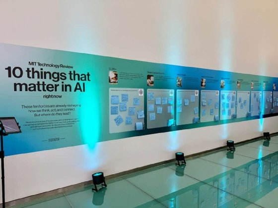 Wall at EmTech AI that lists 