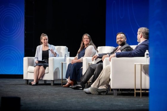 Photo of panelists speaking about scaling AI at Fiber Connect 2026.