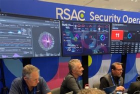 Photo of the RSAC 2026 SOC analysts and alert screens.